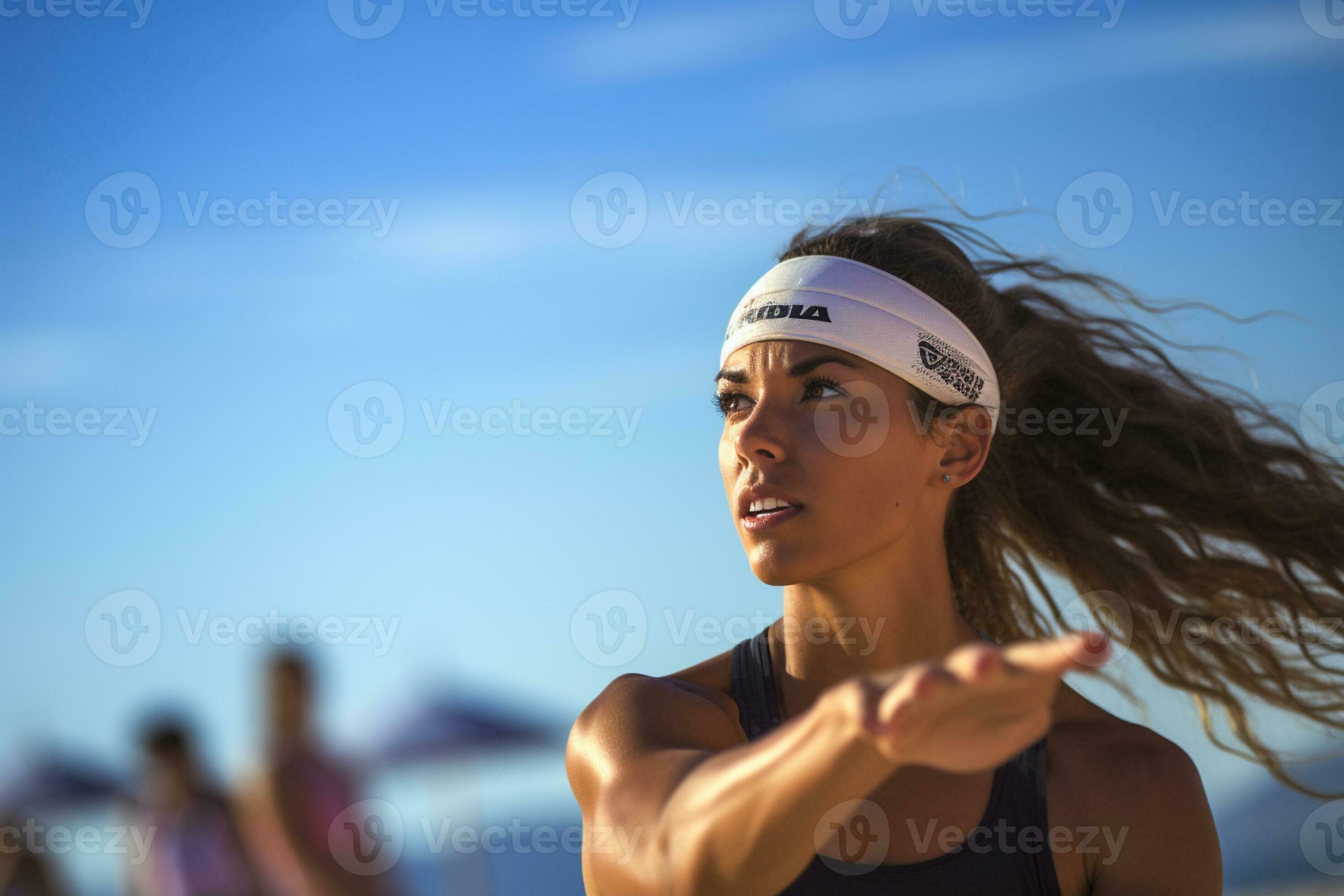 Female beach volleyball players play a volleyball match on the beach