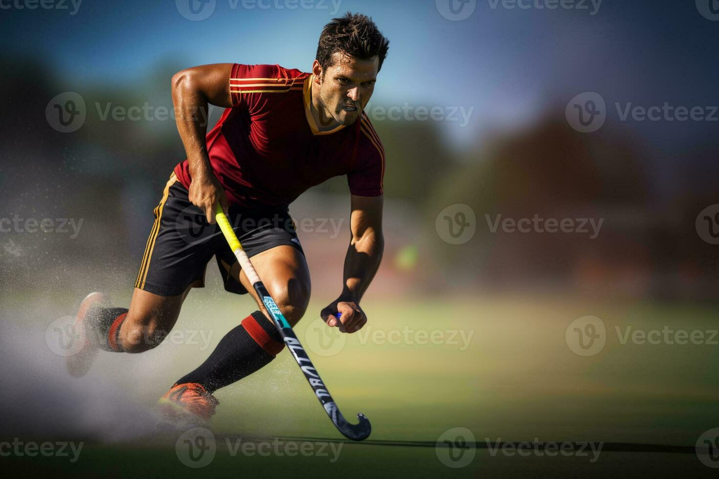 un masculino hockey jugador es jugando campo hockey foto