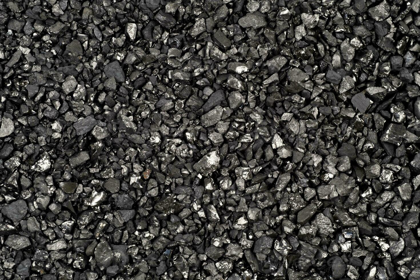 Ion-exchange carbon for water softening beads or granules texture background. carbon water filter for residential drinking or industrial texture surface,top view photo