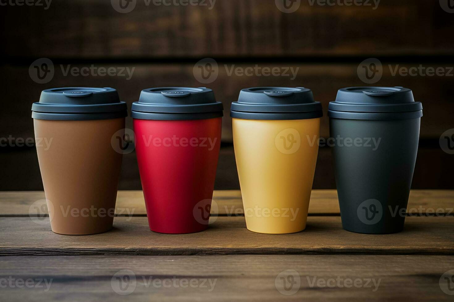 Reusable coffee cups on a rustic wooden table background with empty space for text photo