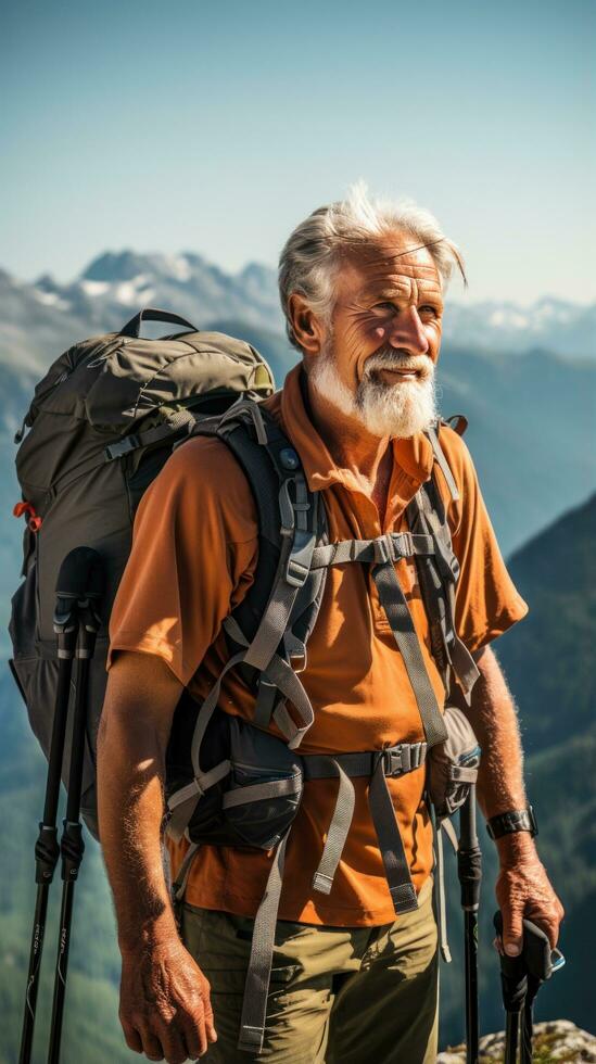 Senior man hiking, backpack, walking stick, mountain range, determined look photo