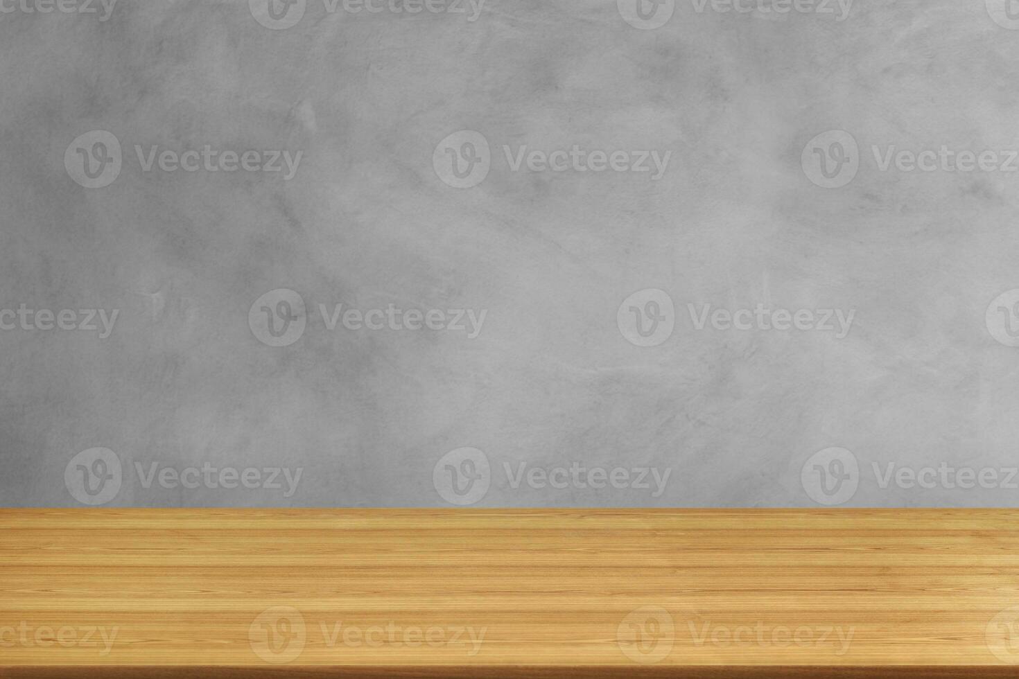 Beautiful empty wooden table. Cement background. photo