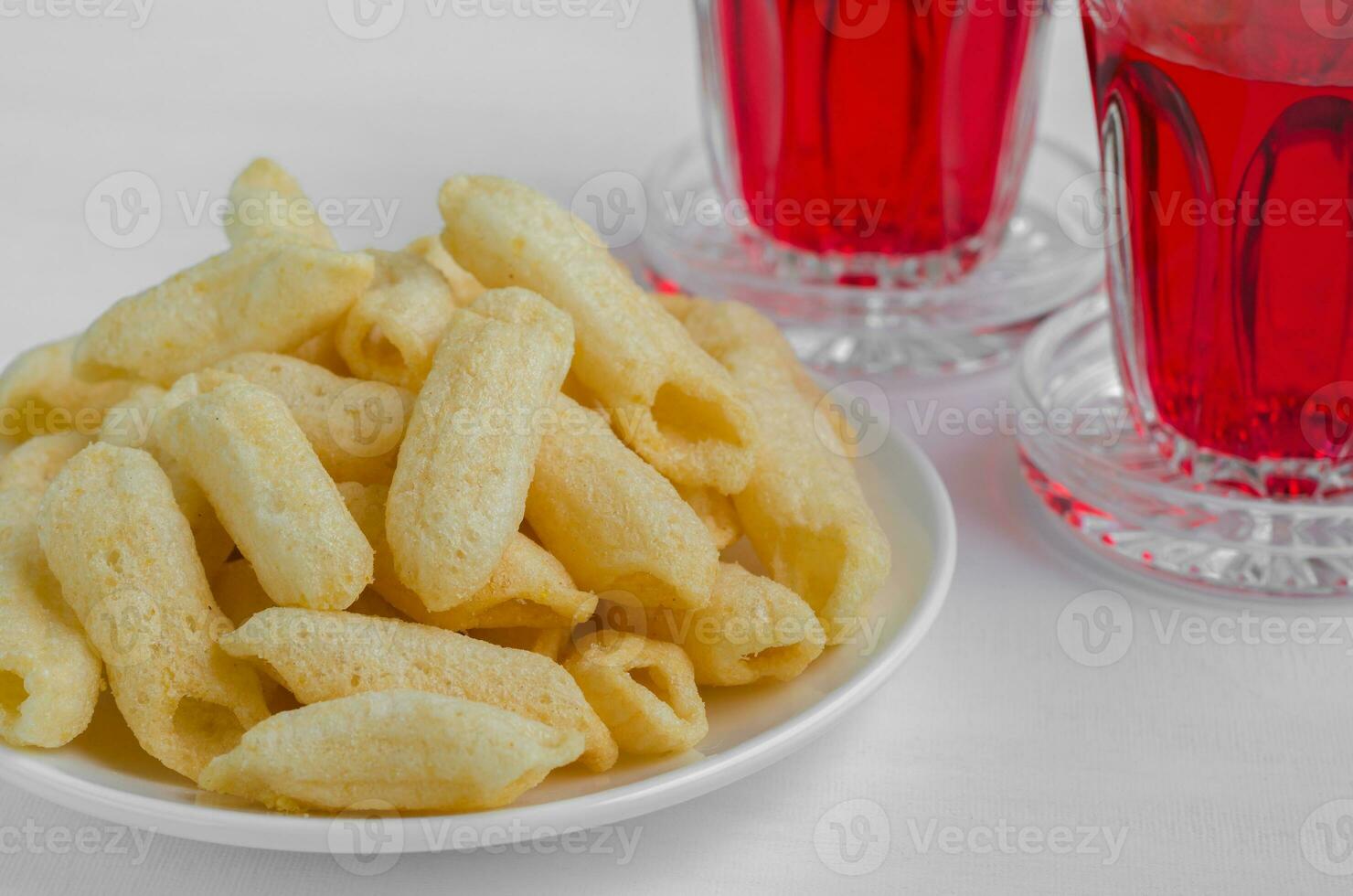 Crispy Snack with Red Soft Drink for Relaxing Time photo