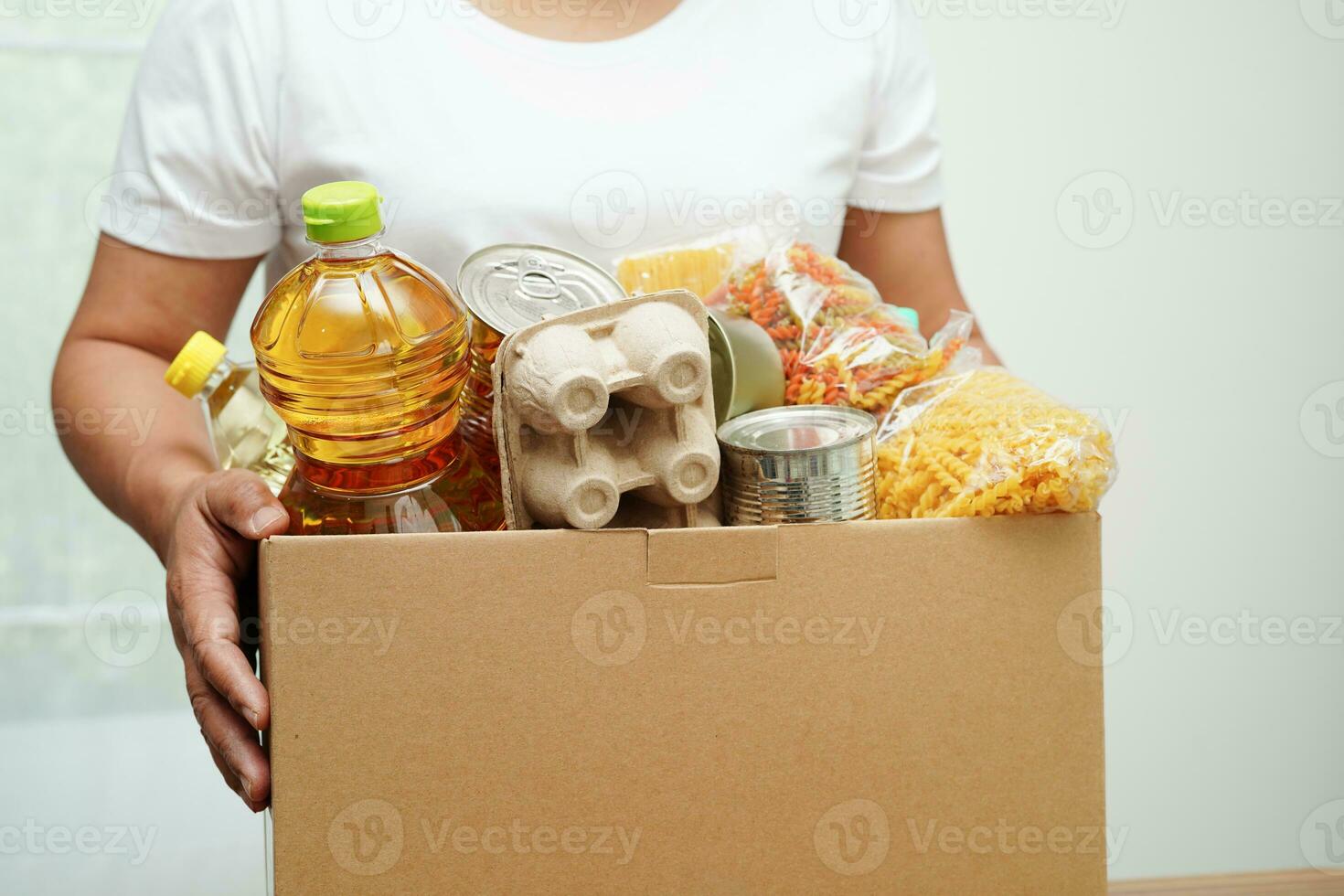 Foodstuffs in donation box for volunteer to help people. photo