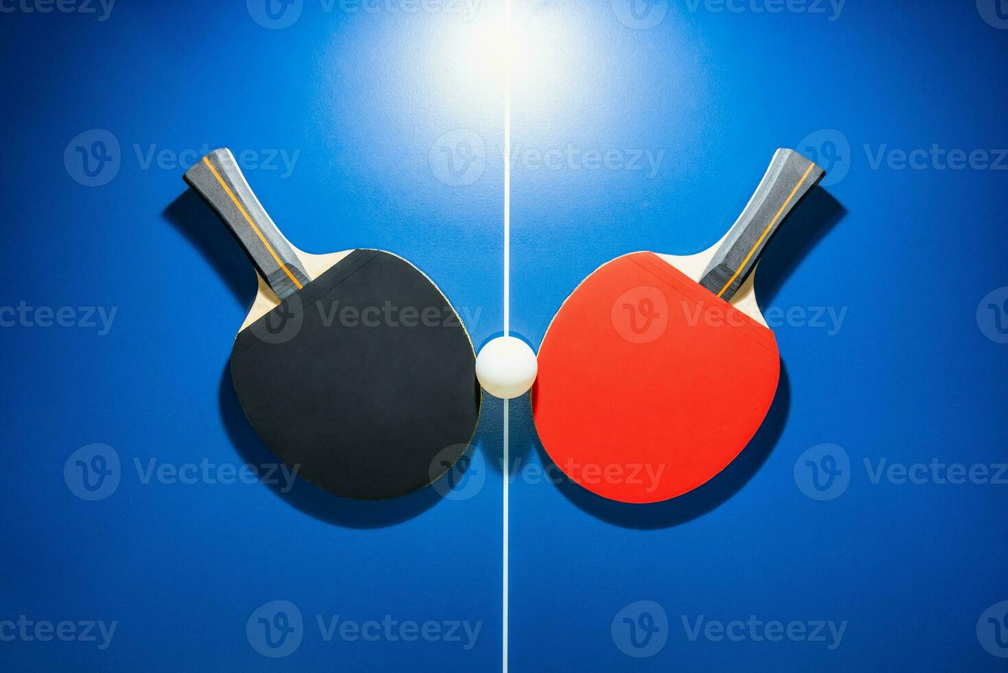 Top view black and red table tennis racket photo