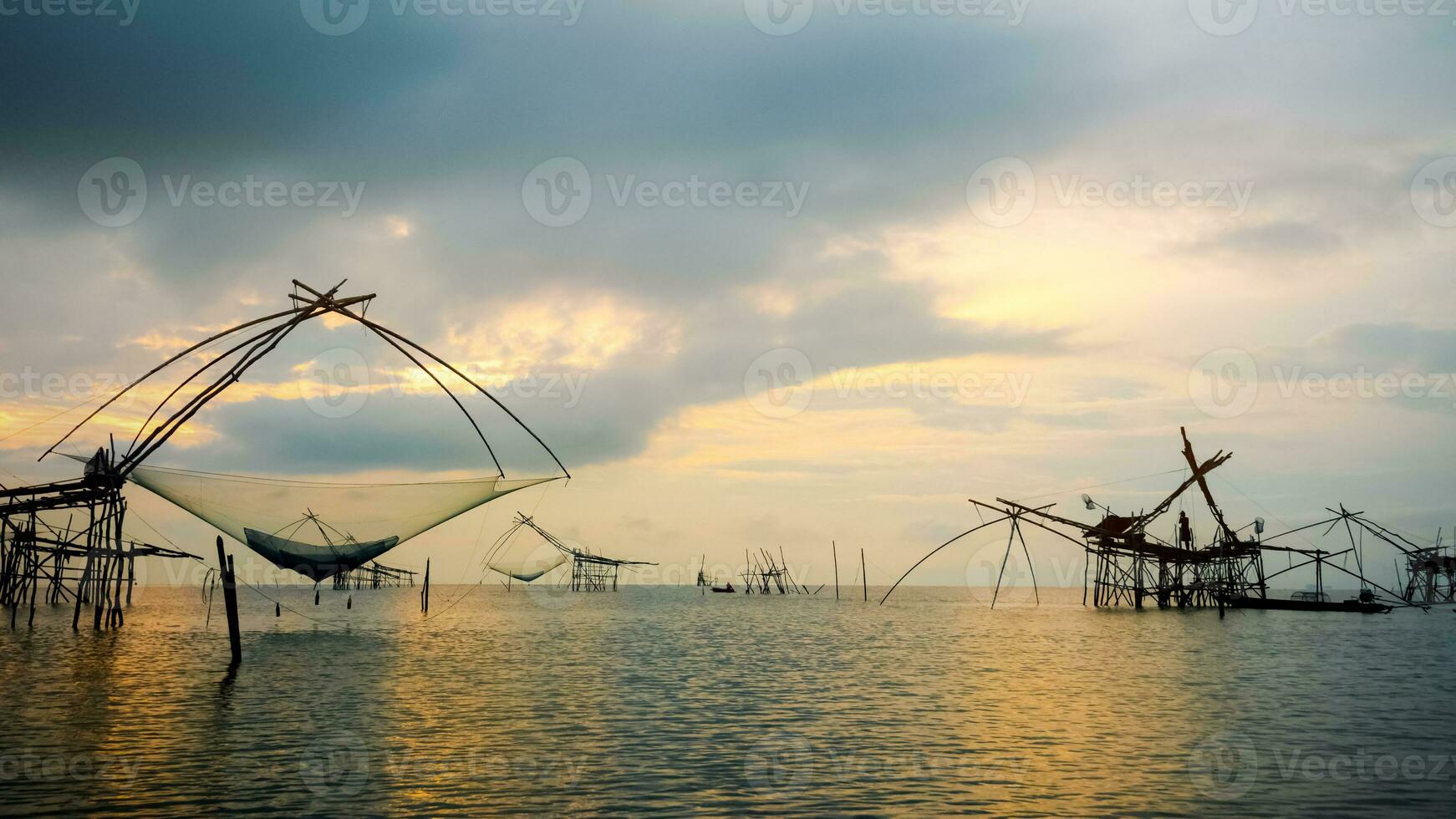 Fisherman are fishing at Pakpra canal during sunrise rural lifestyle in Thailand photo