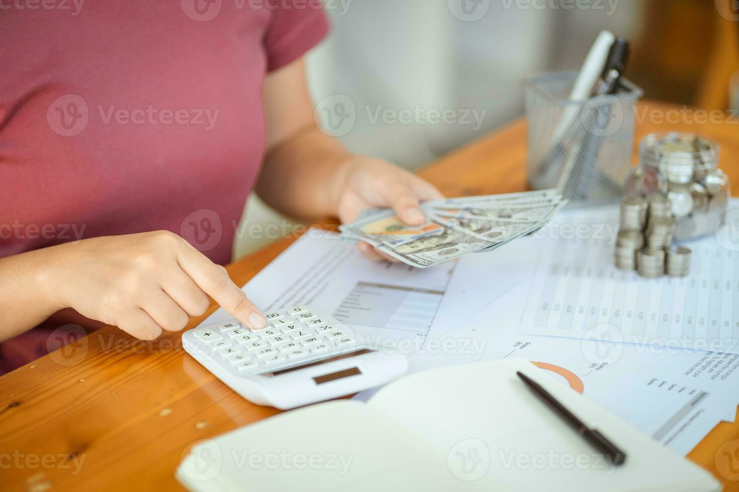 Saving money. Businessman Accountant verify growing business and saving money stacking coins with calculator. Accountancy Concept. photo