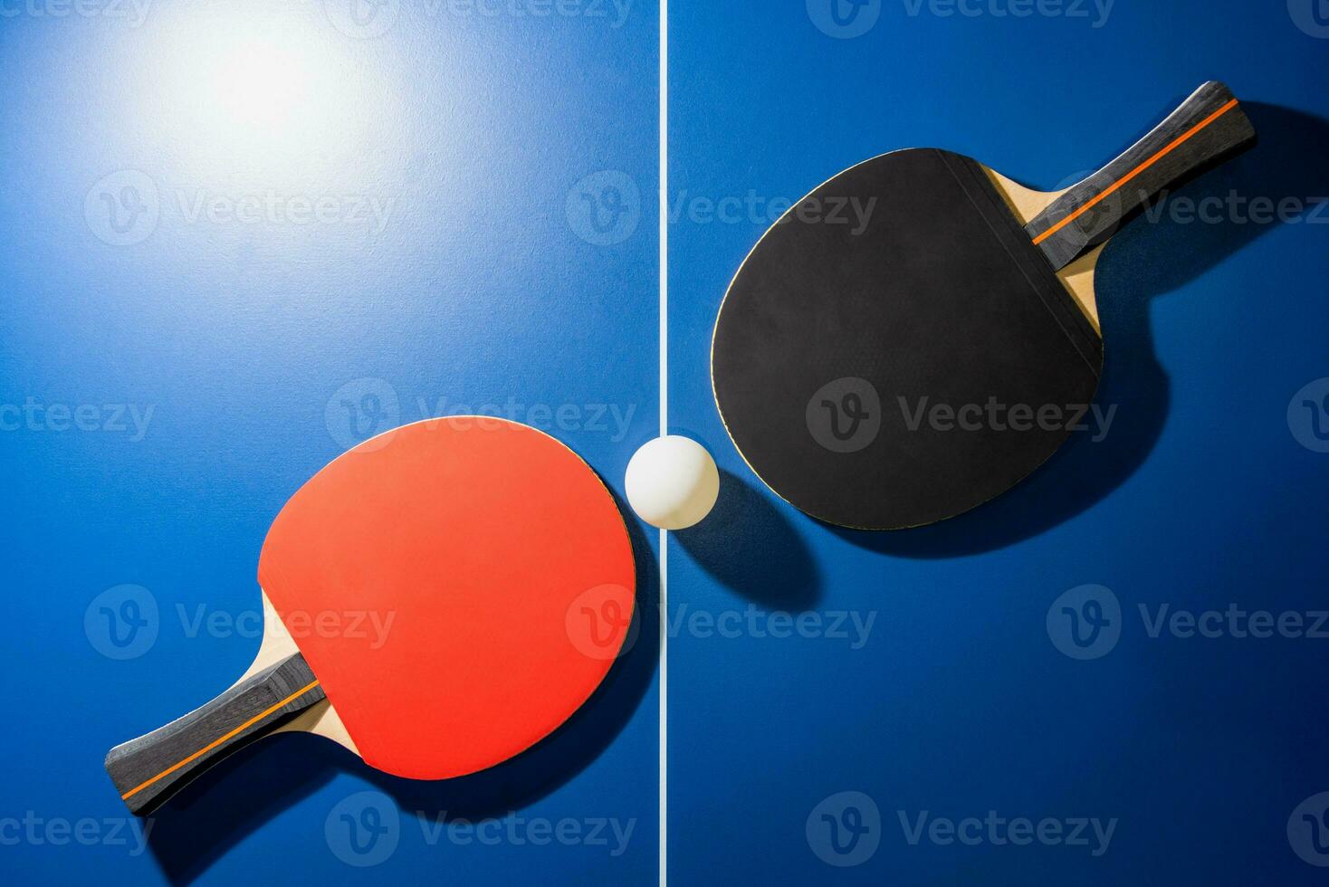 Top view black and red table tennis racket photo