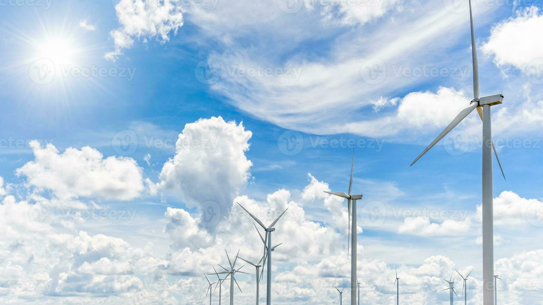 Beautiful many windmills under the sun photo