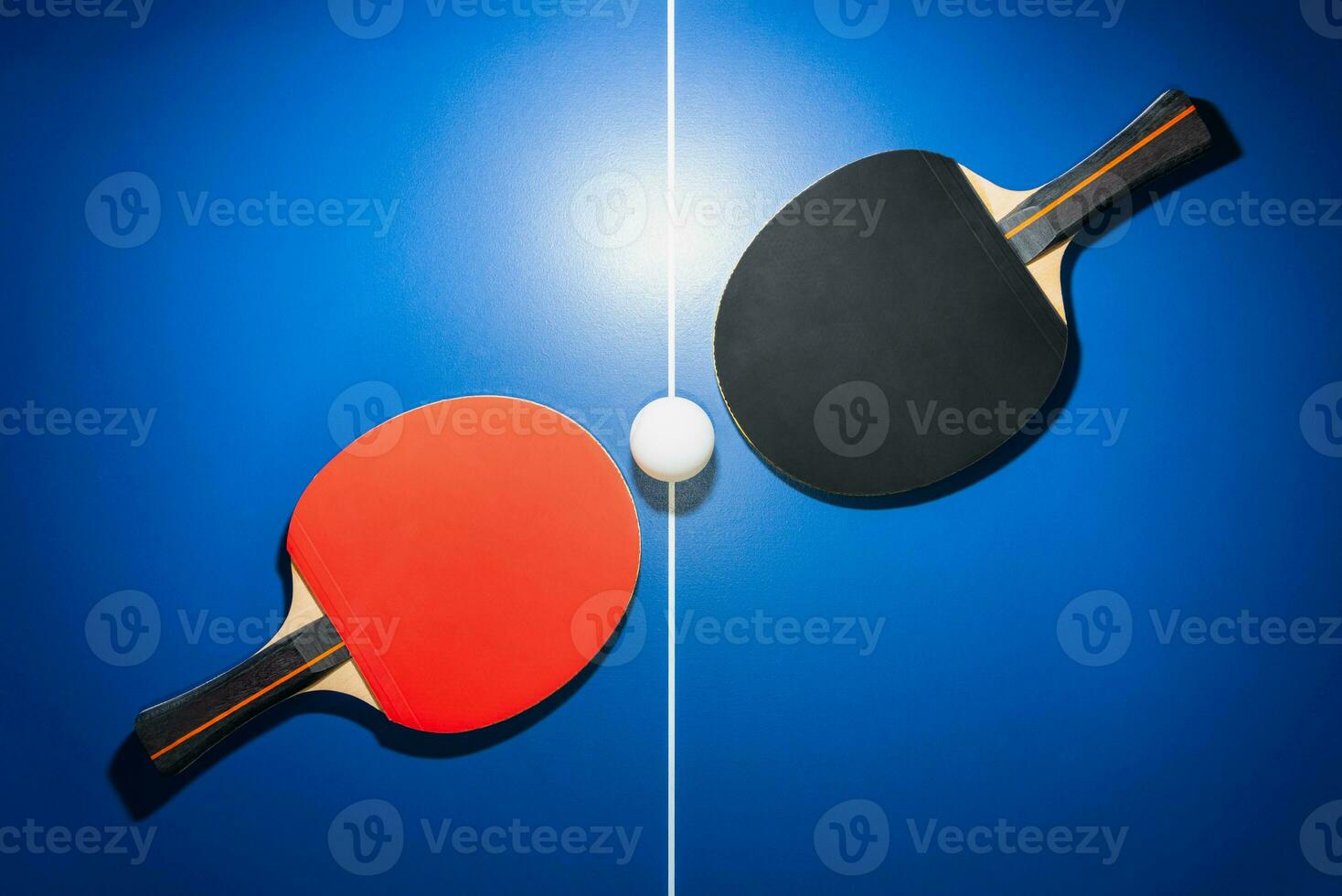 Top view black and red table tennis racket photo