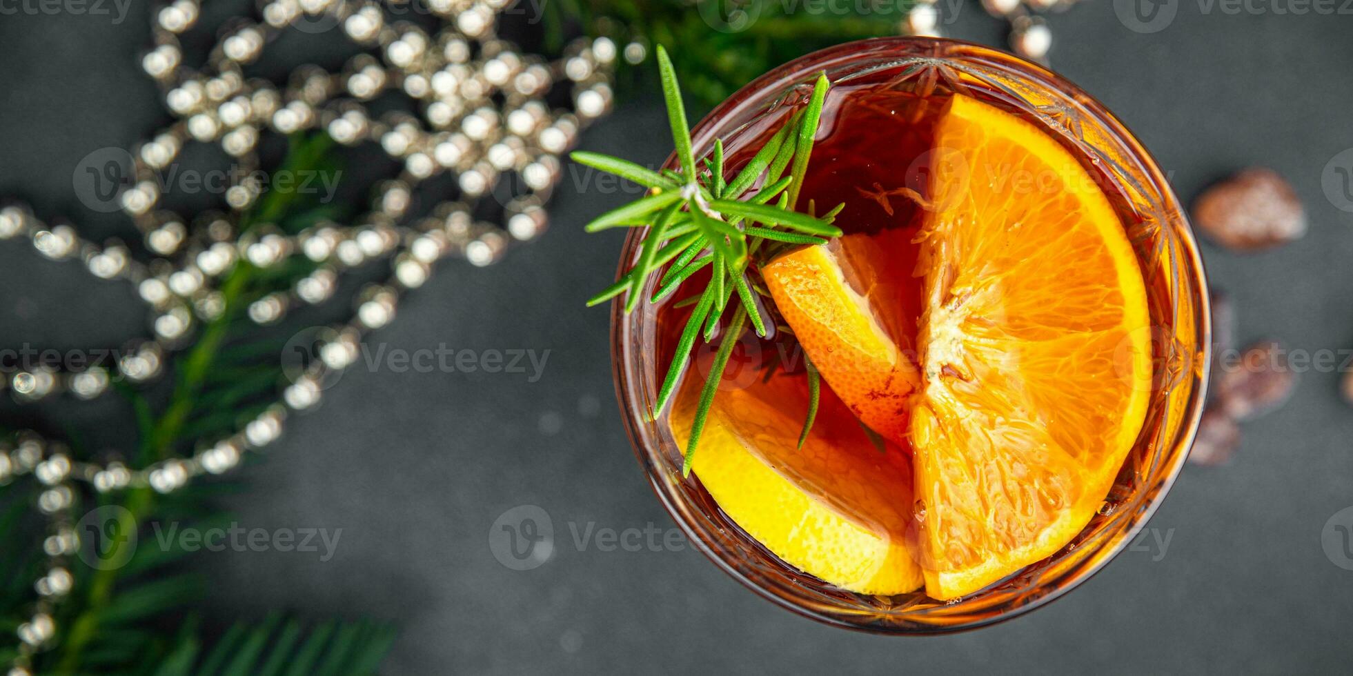 christmas mulled wine cocktail citrus and rosemary traditional drink new year holiday appetizer meal food snack on the table photo