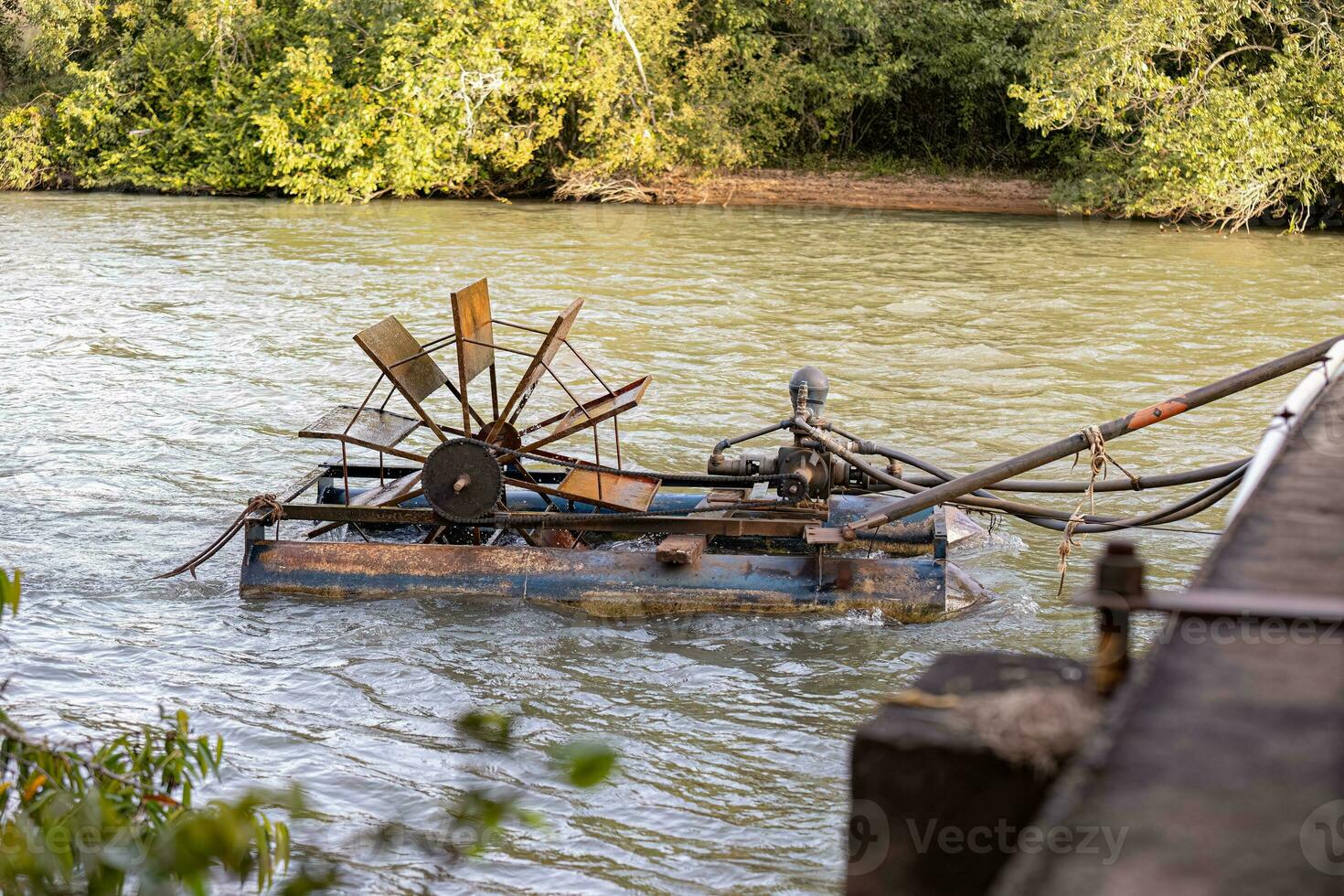 water pumping system by water wheel and pump photo