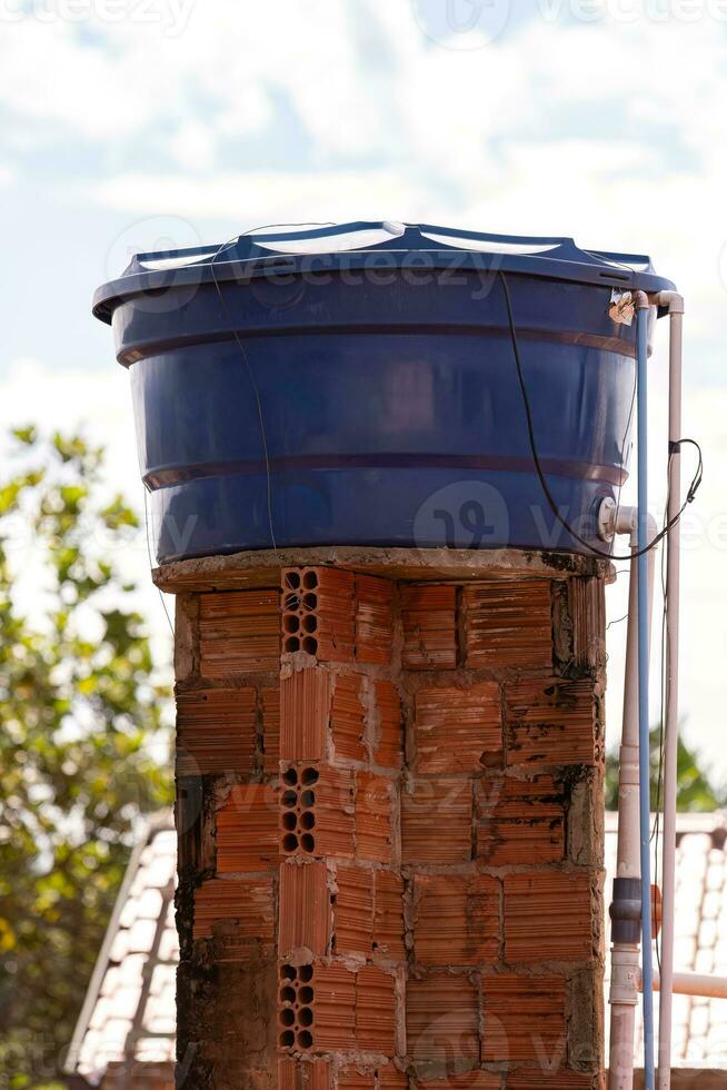 Blue plastic water tank photo