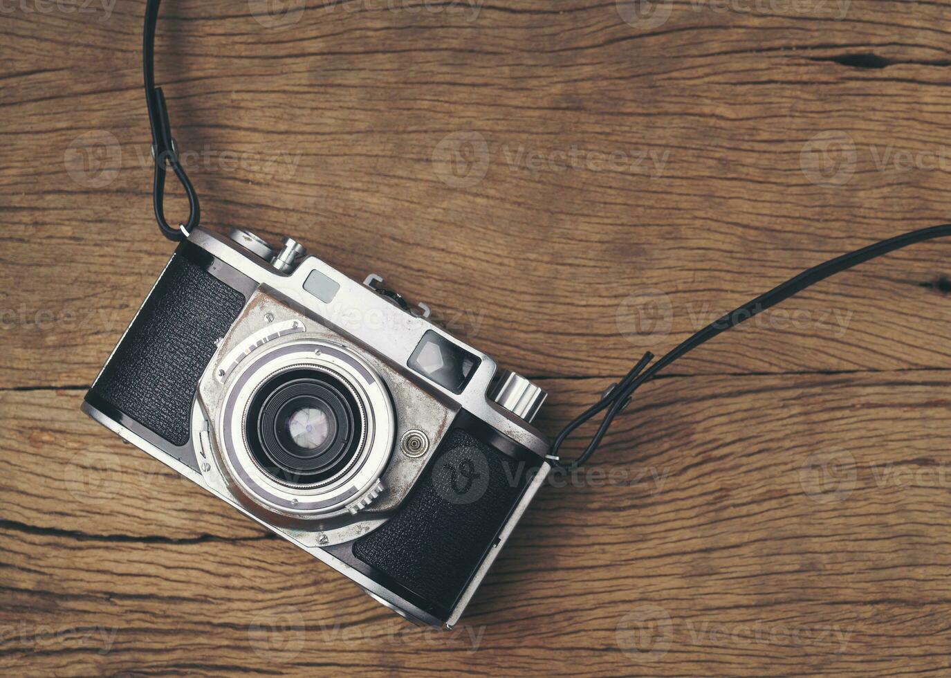 vintage old film camera on wood board photo