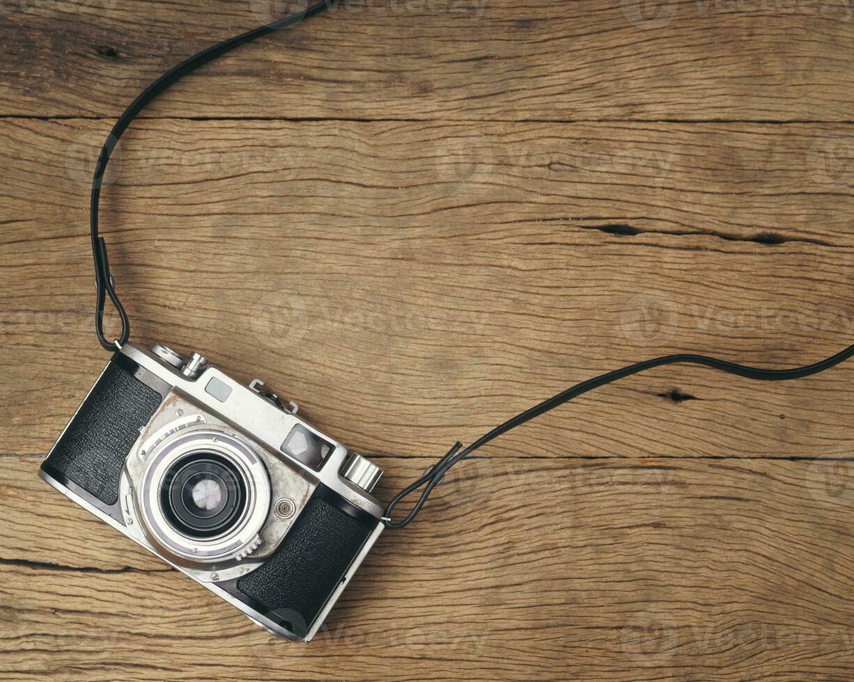 vintage old film camera on wood board photo