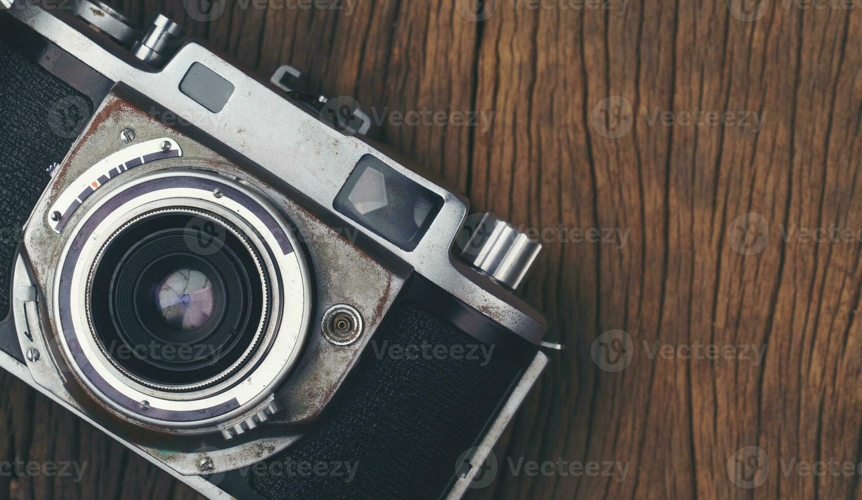 vintage old film camera on wood board photo