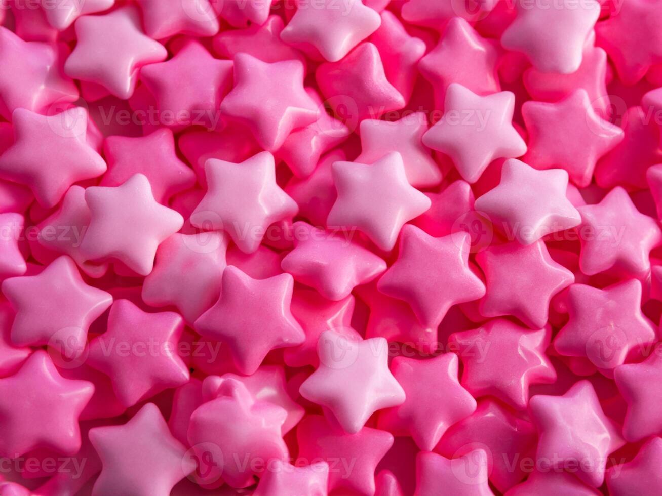 pink stars candies background, close up photo