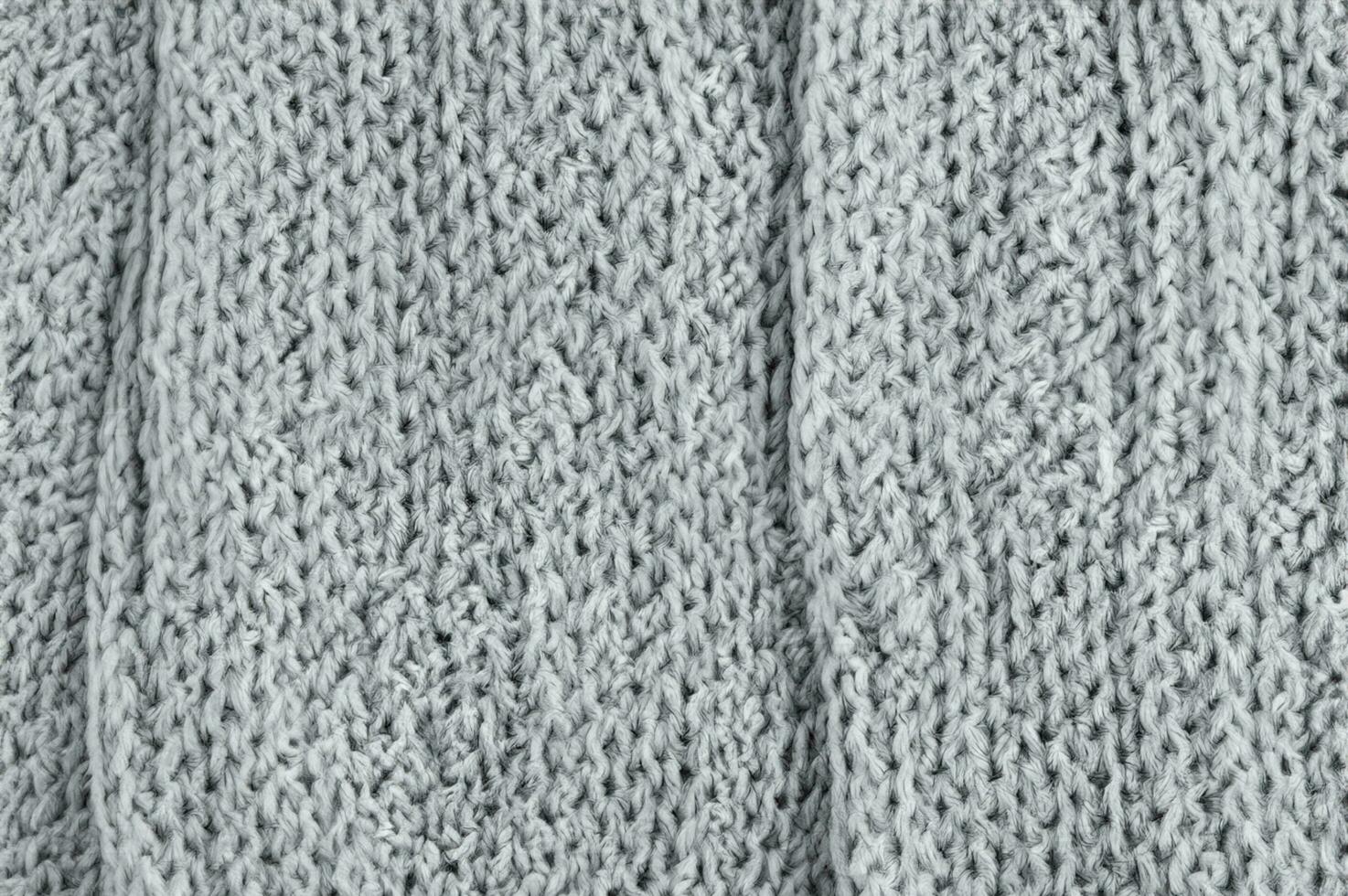 gray knitted fabric background texture, abstract wool texture background. photo