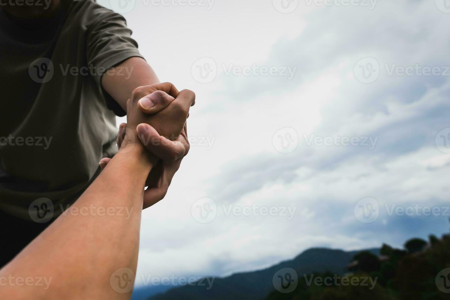 Help concept hands reaching out to help each other. photo