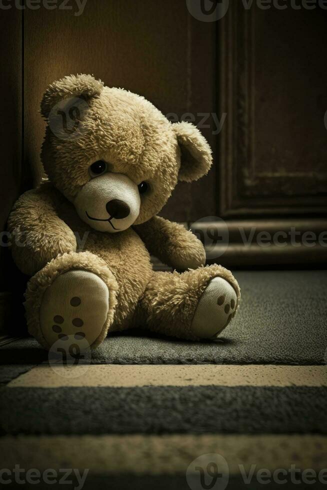 Lonely Teddy Bear on the Floor  Symbol of Solitude and Sadness for Greeting Cards and Posters photo