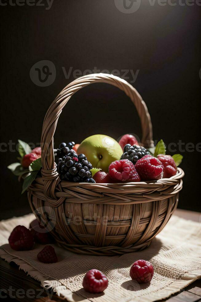 Studio Shot of the basket with berries and fruits on the table photo