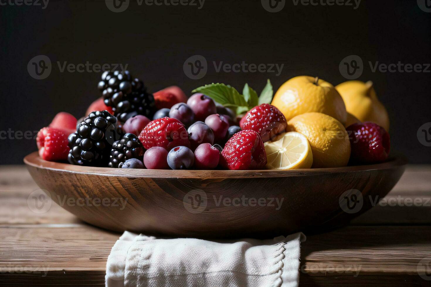 Studio Shot of the basket with berries and fruits on the table photo