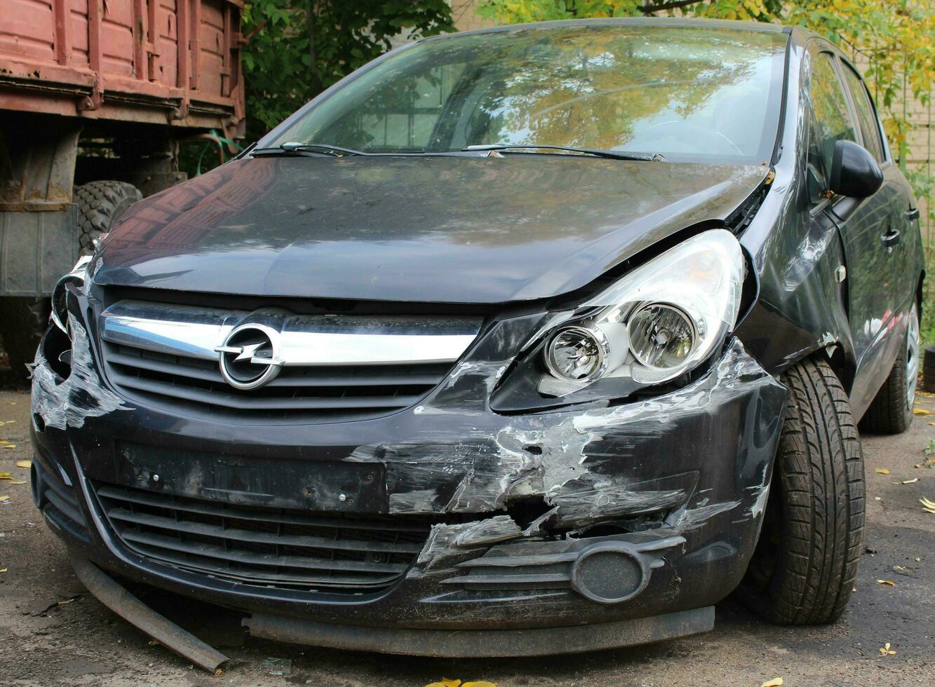 Sankt Petersburg Russia - 10 03 2023 Isolate side of the car, the color of Braun White, which crashed with another car until it was demolished. photo