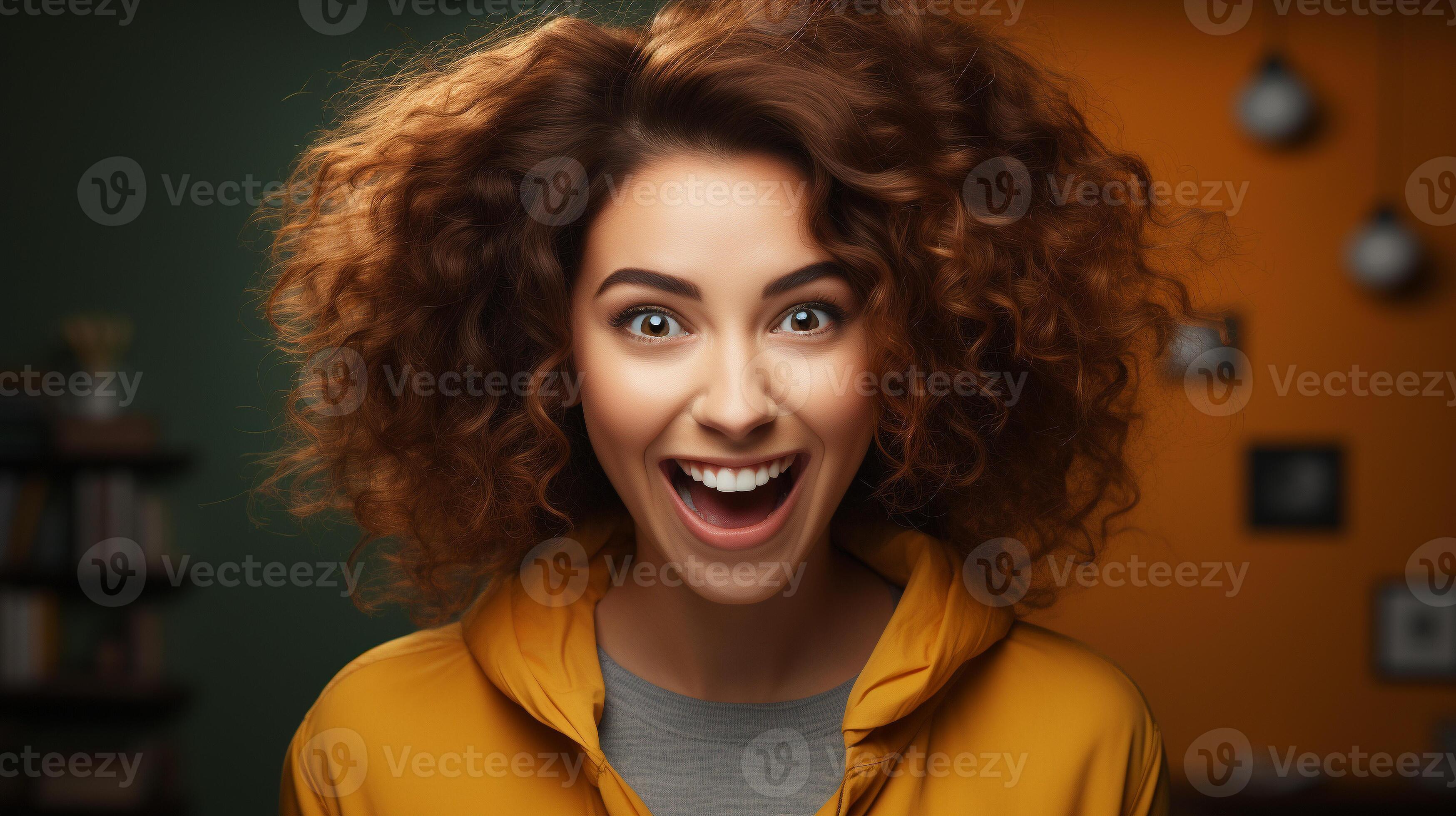 Deliriously happy and excited young adult girl smiling in her office or