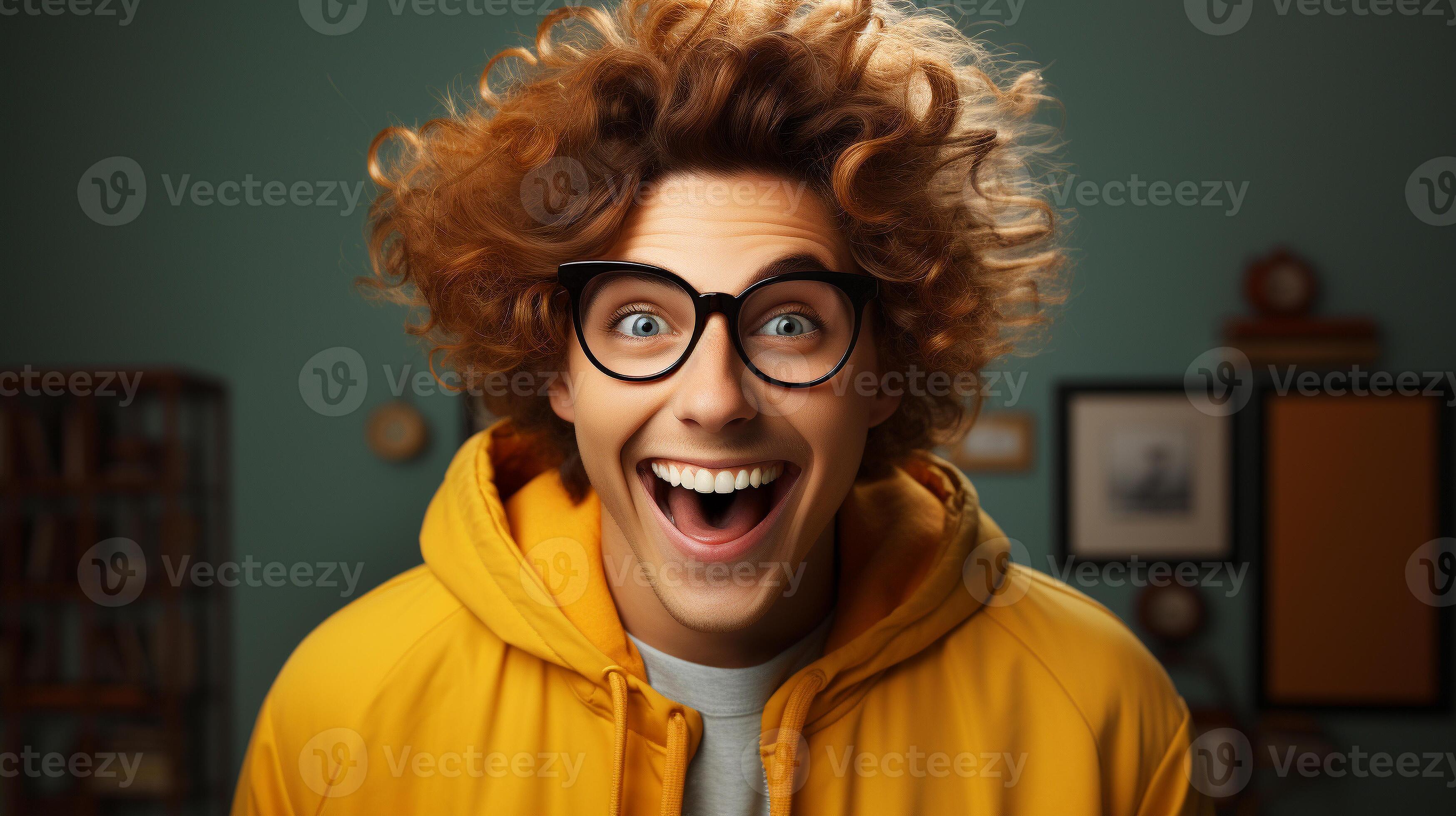 Deliriously happy and excited guy wearing glasses smiling in his office