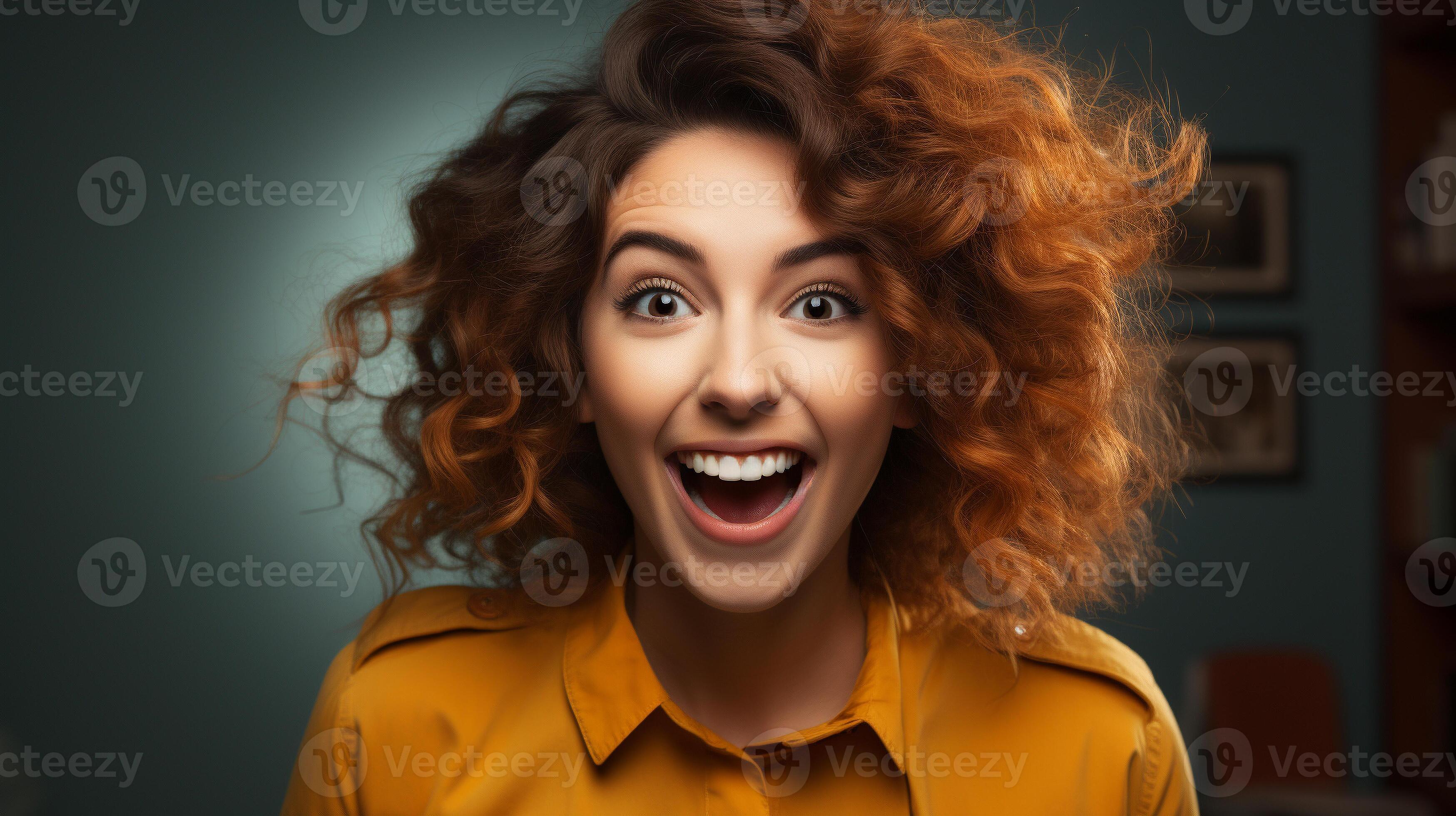 Deliriously happy and excited young adult girl smiling in her office or