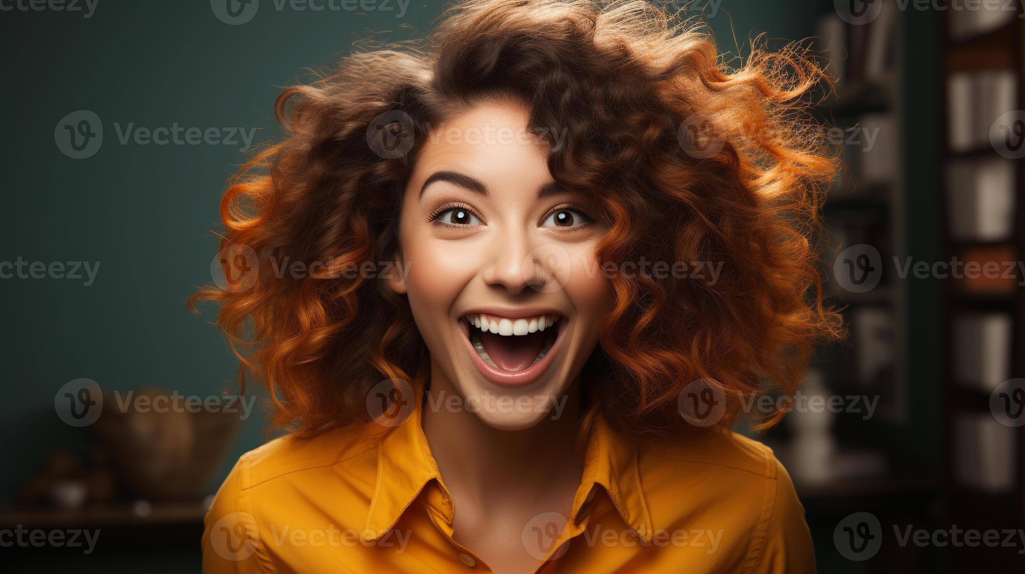 Deliriously happy and excited young adult girl smiling in her office or