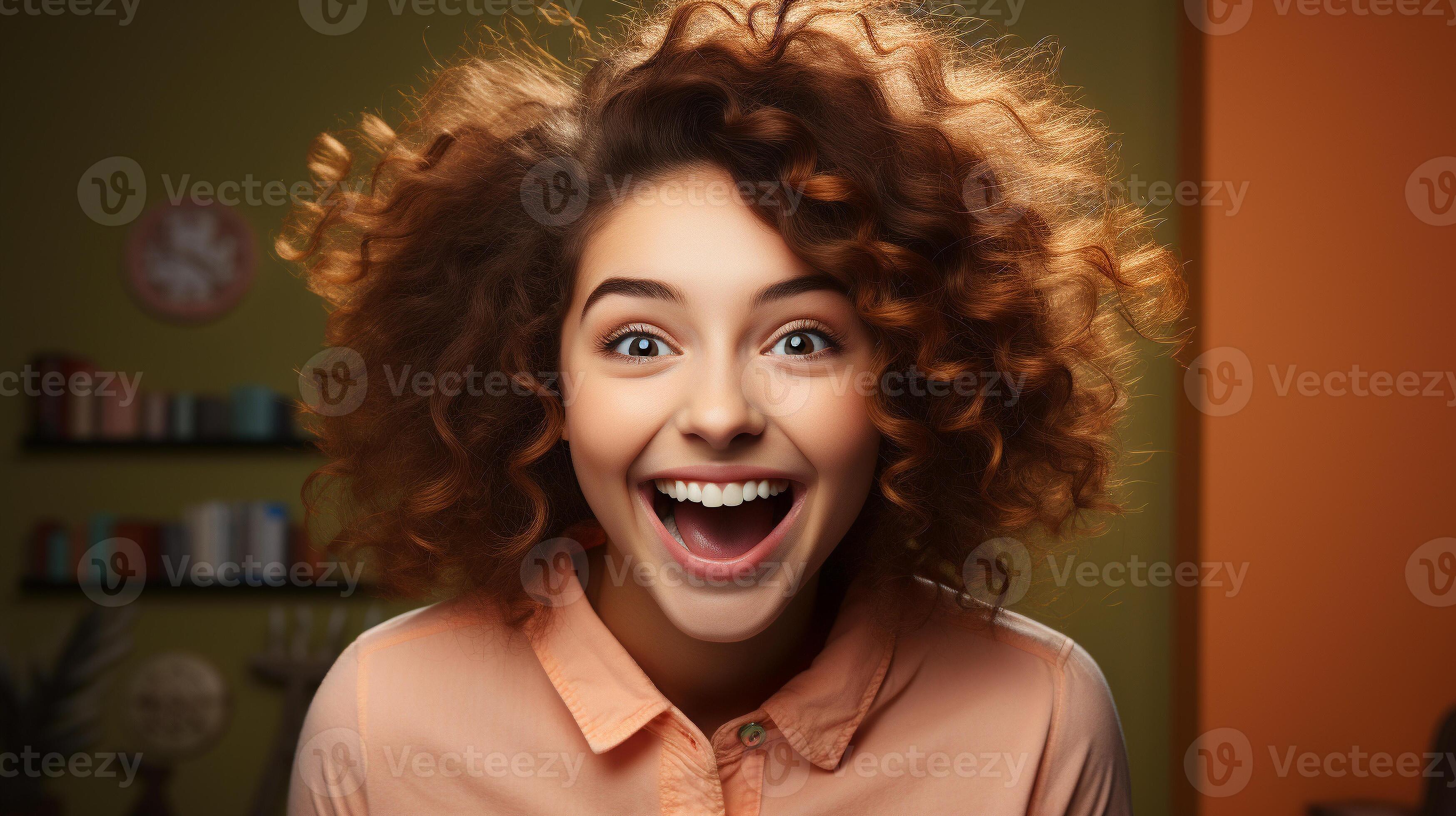 Deliriously happy and excited young adult girl smiling in her office or