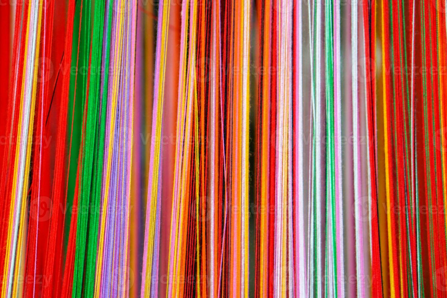 Closeup and crop colorful yarns for woven fabrics background and texture. photo