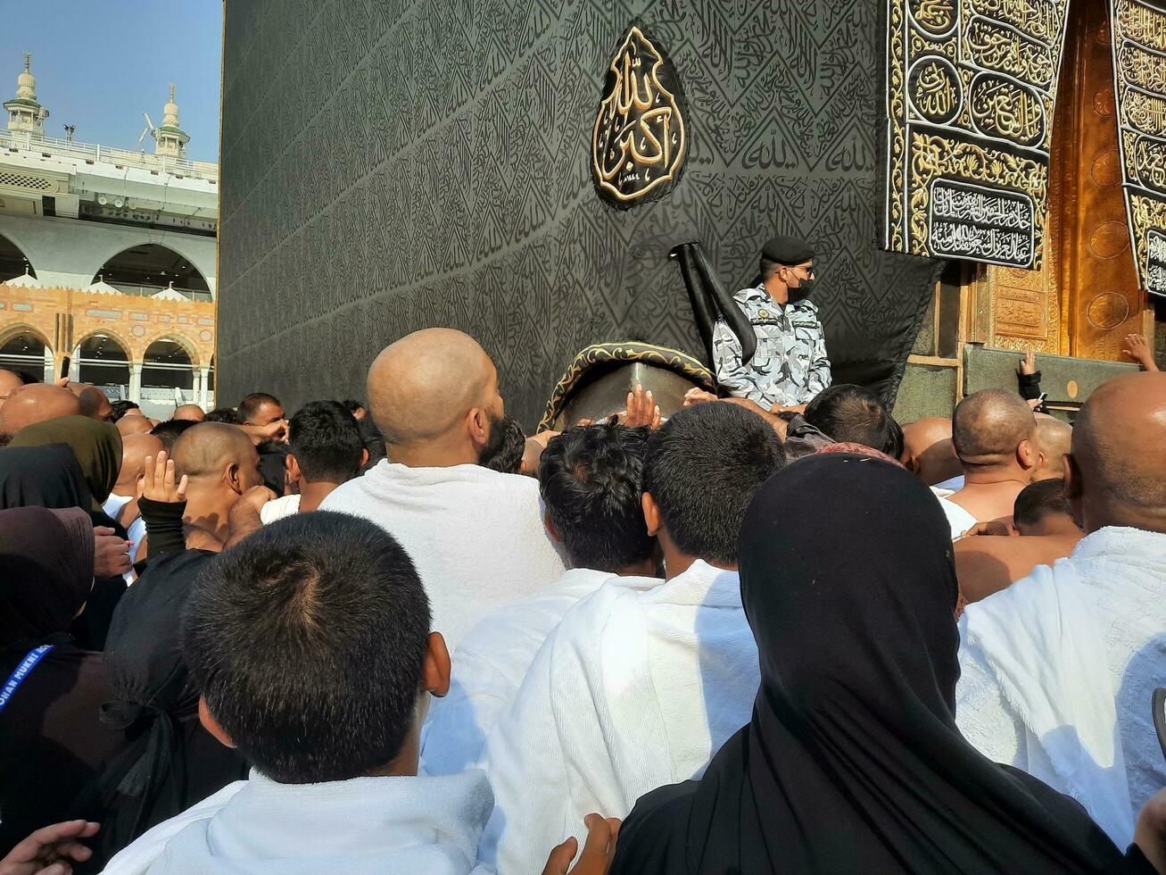 Mecca, Saudi Arabia, Aug 2023 - Pilgrims from different parts of the world queue up to kiss the Black Stone at Masjid Al Haram, Mecca. photo