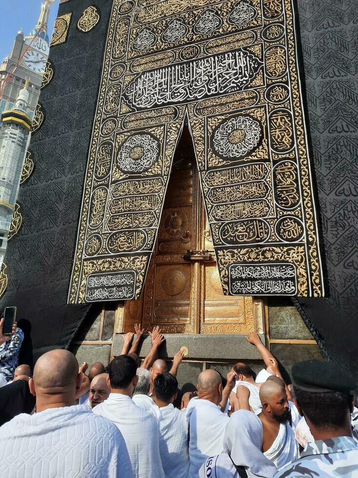 Mecca, Saudi Arabia, Aug 2023 -  Pilgrims from all over the world gather near the door of the Kaaba in Masjid Al Haram. photo