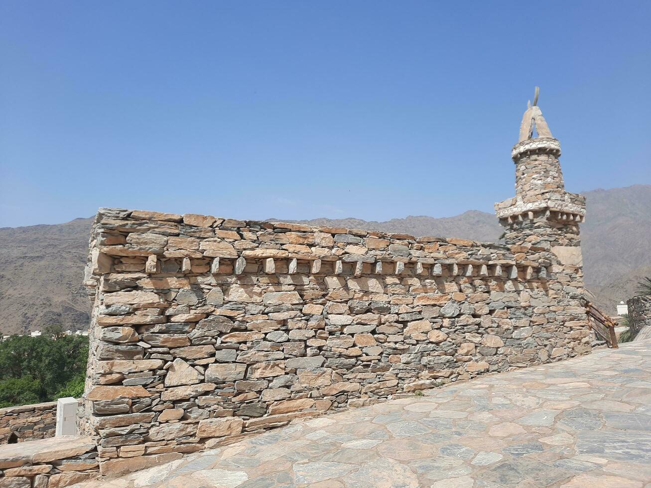 Al Bahah, Saudi Arabia, Sep 2023 - Beautiful daytime view of the historical ruins of Thee Ain Zee Ain or Dhee Ain  Ancient Village in Al Bahah, Saudi Arabia. photo