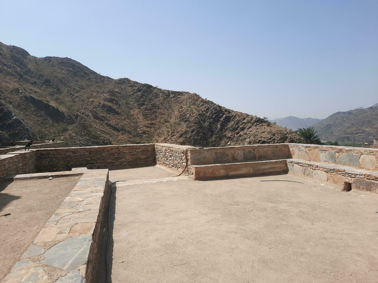 Al Bahah, Saudi Arabia, Sep 2023 - Beautiful daytime view of the historical ruins of Thee Ain Zee Ain or Dhee Ain  Ancient Village in Al Bahah, Saudi Arabia. photo