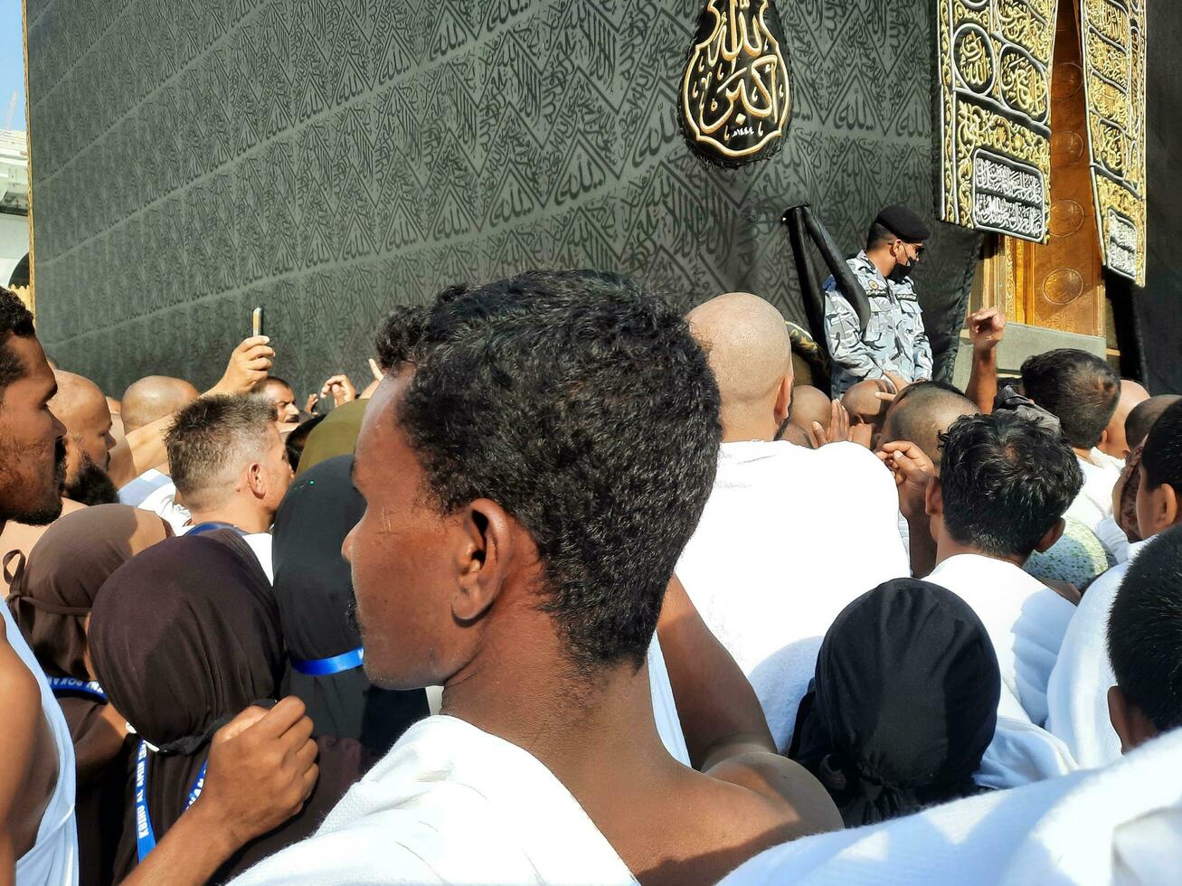 Mecca, Saudi Arabia, Aug 2023 - Pilgrims from different parts of the world queue up to kiss the Black Stone at Masjid Al Haram, Mecca. photo