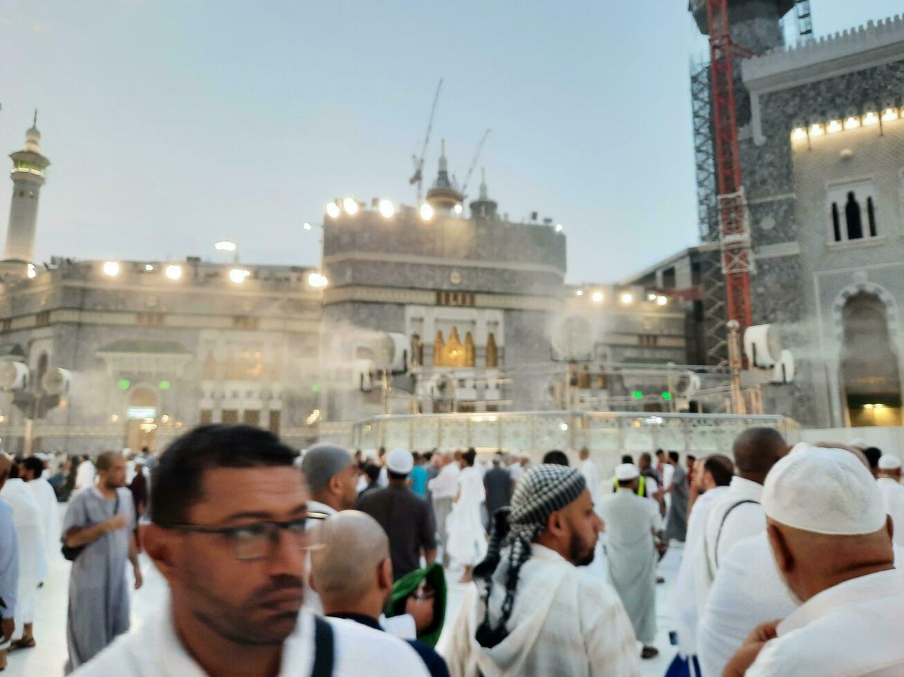 Mecca, Saudi Arabia, Sep 2023 - At Masjid Al Haram, Mecca, pilgrims from all over the world gather in the outer courtyard of Masjid Al Haram for Maghrib prayers. photo