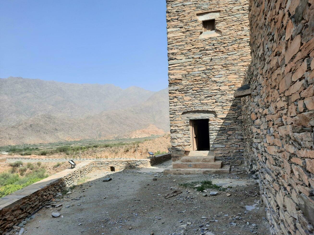 Al Bahah, Saudi Arabia, Sep 2023 - Beautiful daytime view of the historical ruins of Thee Ain Zee Ain or Dhee Ain  Ancient Village in Al Bahah, Saudi Arabia. photo