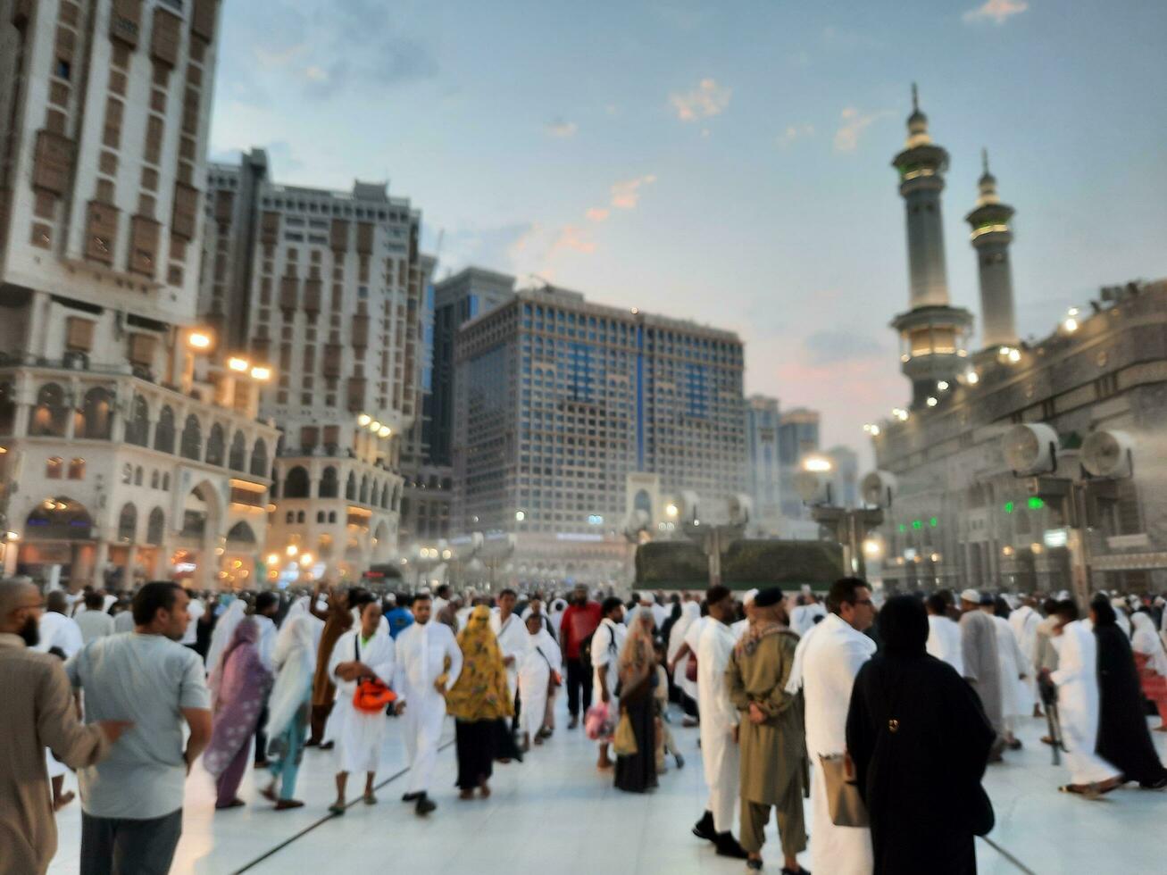 Mecca, Saudi Arabia, Sep 2023 - At Masjid Al Haram, Mecca, pilgrims from all over the world gather in the outer courtyard of Masjid Al Haram for Maghrib prayers. photo