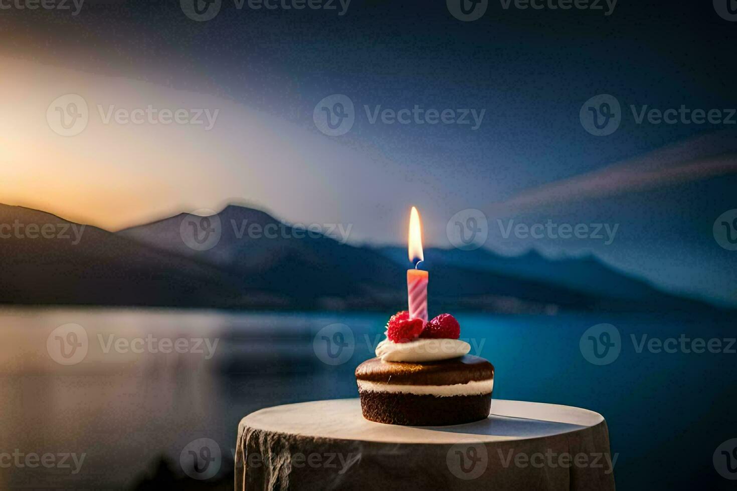 a cupcake with a candle on top of a table in front of a lake. AI-Generated photo