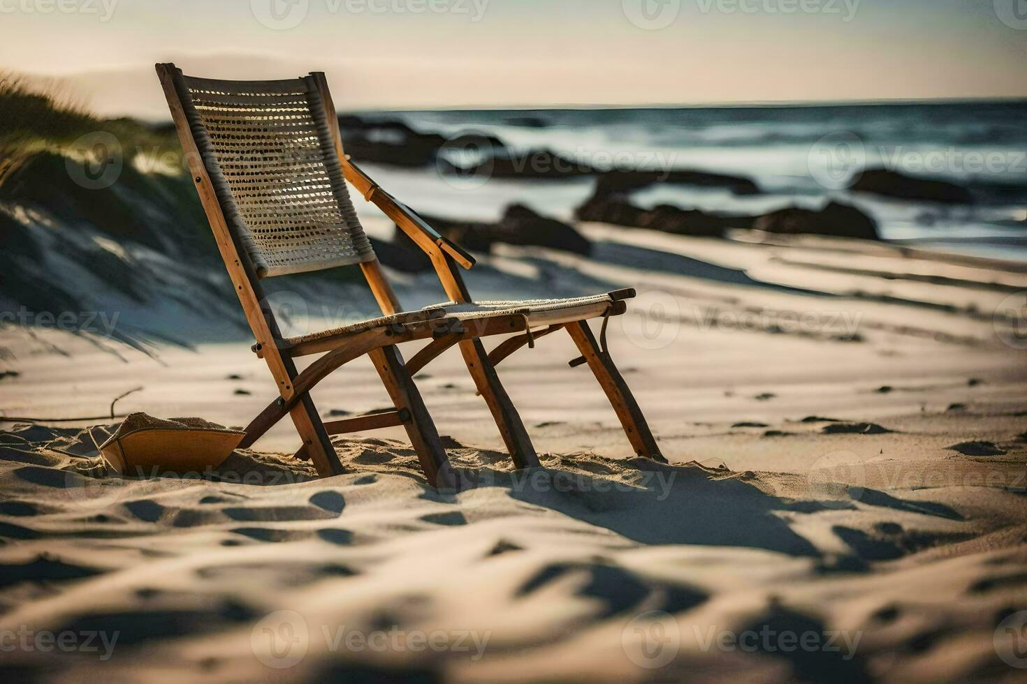 a wooden chair sits on the beach at sunset. AI-Generated photo