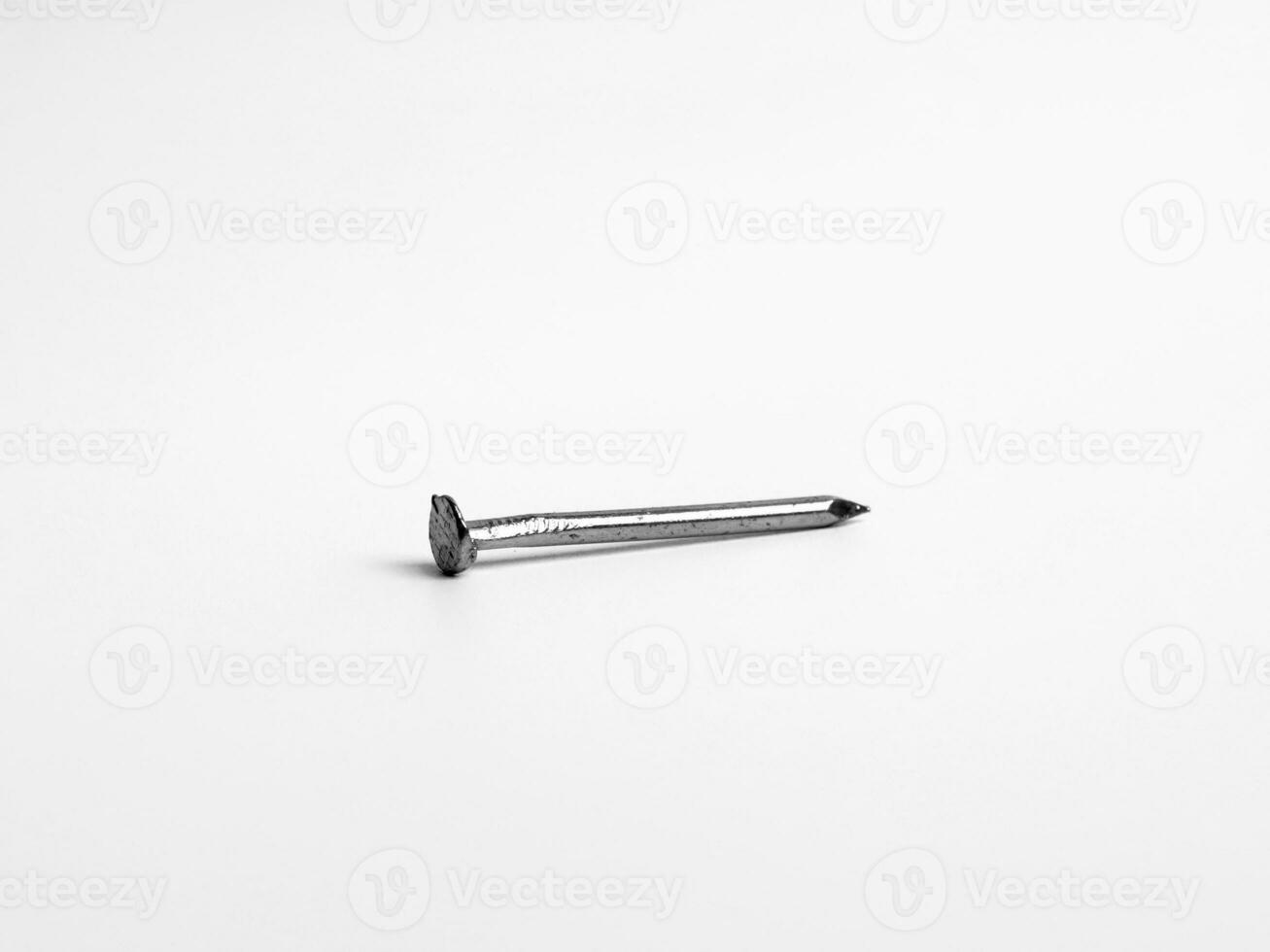 One Silver Shiny Sharp Metal Nail Closeup Photo Isolated On White Background