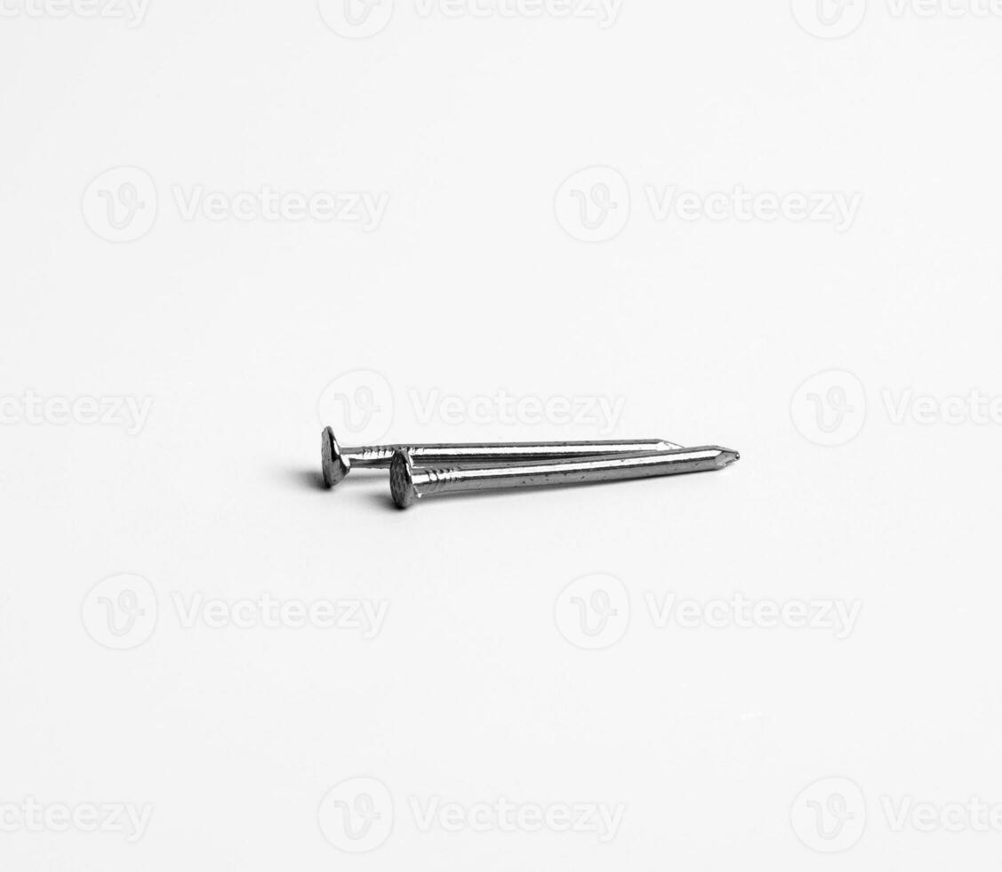 Two Silver Shiny Sharp Metal Nails Closeup Photo Isolated On White Background