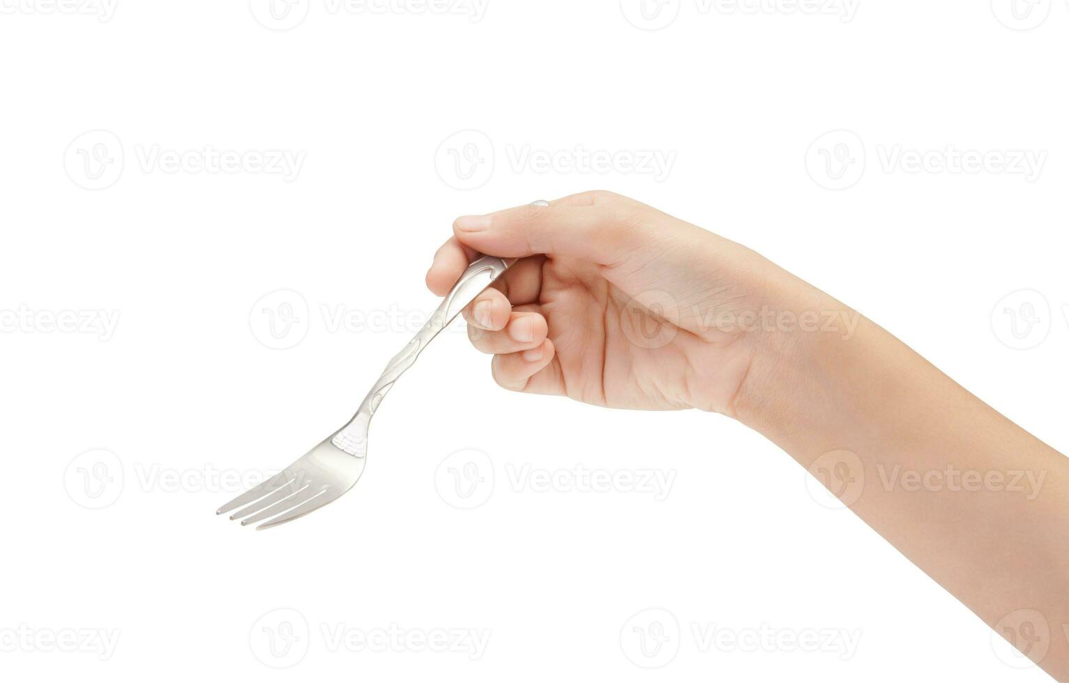 Female Hand Holding A Silver Stainless Fork Closeup Photo Isolated On White Background
