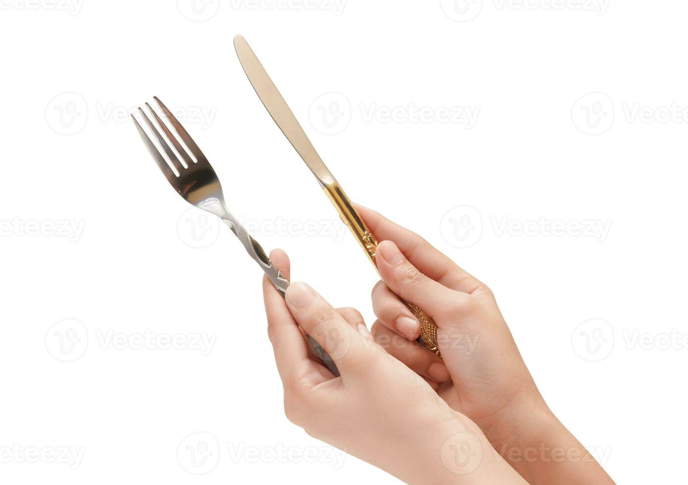 Female Hand Holding A Silver Stainless Fork And Knife Closeup Photo Isolated On White Background