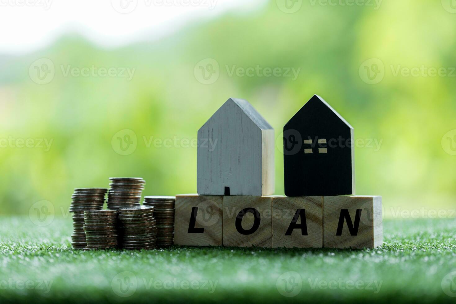 Business loans for real estate concept, money with model home on the table on bokeh background in the public park. photo