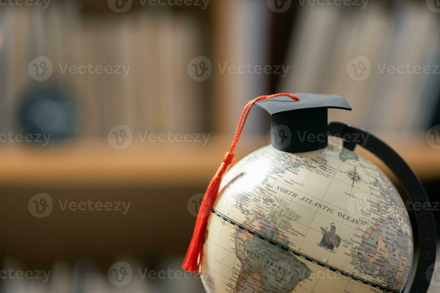 Graduation cap with Earth globe. Concept of global business study, abroad educational, Back to School. Education in Global world, Study abroad business in universities in worldwide. language study photo