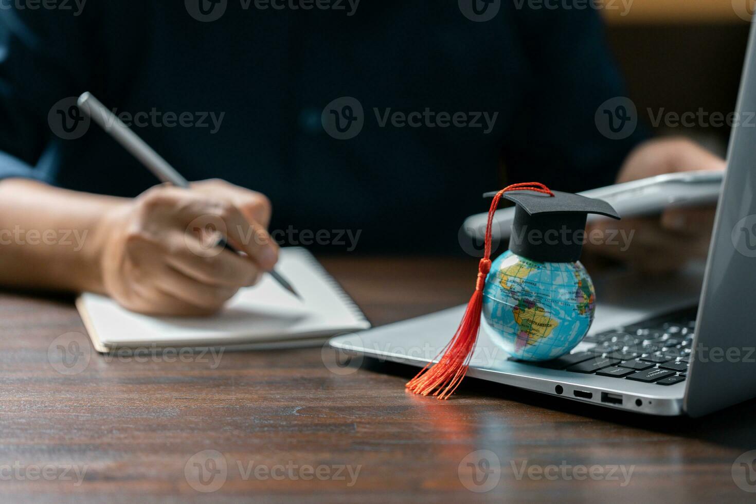 Graduation cap with Earth globe. Concept of global business study, abroad educational, Back to School. Education in Global world, Study abroad business in universities in worldwide. language study photo